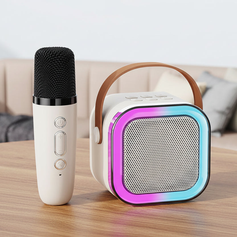 Portable karaoke machine with microphone on a table.
