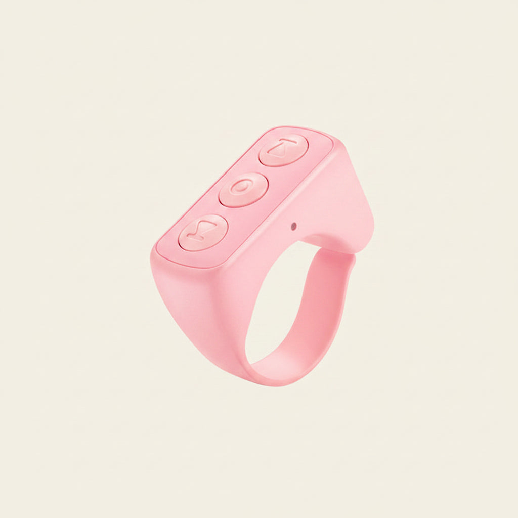 Pink Bluetooth Remote Control Ring with buttons and text on a beige background