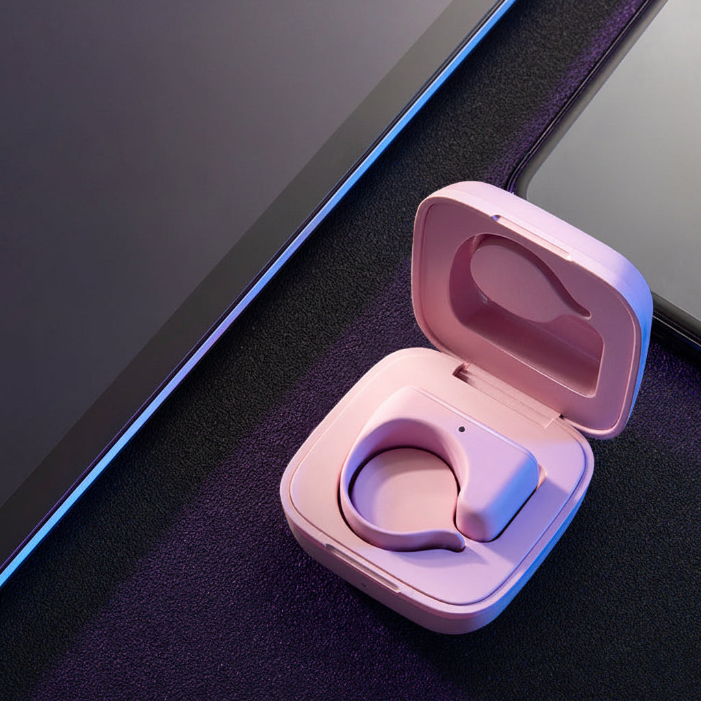 Pink wireless Bluetooth Remote Control Ring in a case on a dark surface.